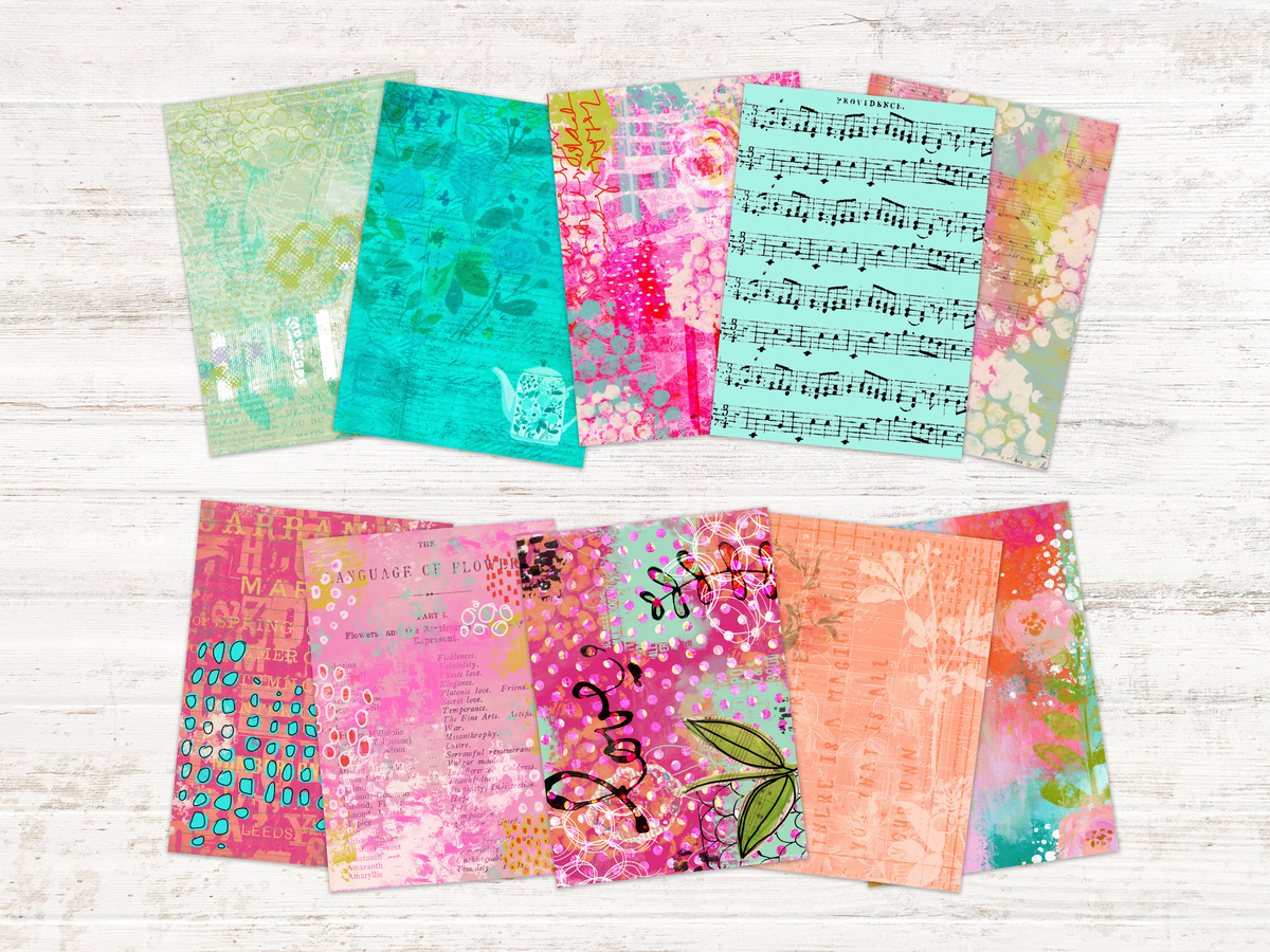 Colourful mixed-media papers arranged on a studio table